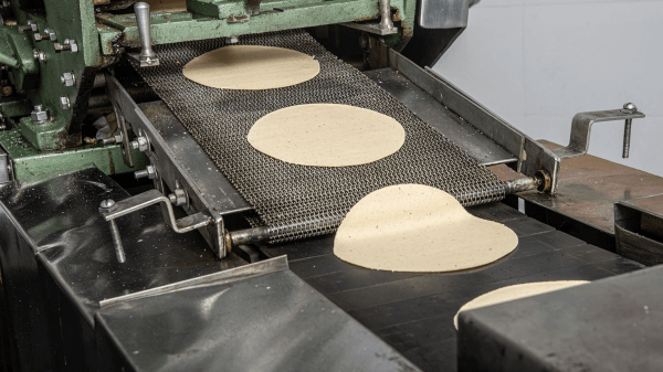 Tortillas coming out of machine